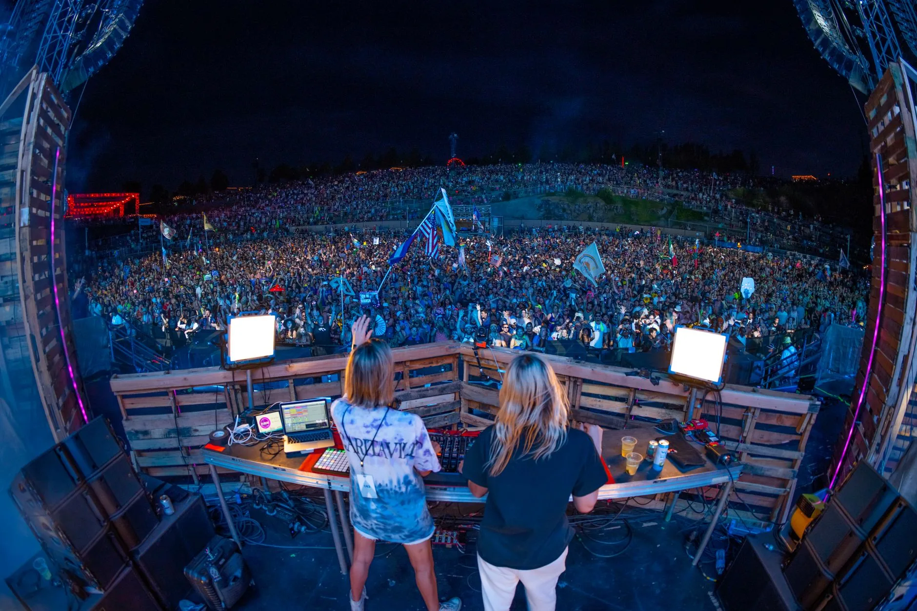 A packed concert venue with stage lights